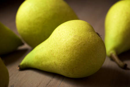 Close-up of a pears on a wooden table.の写真素材