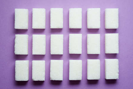 Sugar cubes on a table.