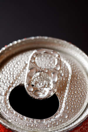 Close-up of a can of soda on a table.