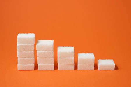 Sugar cubes on a table.