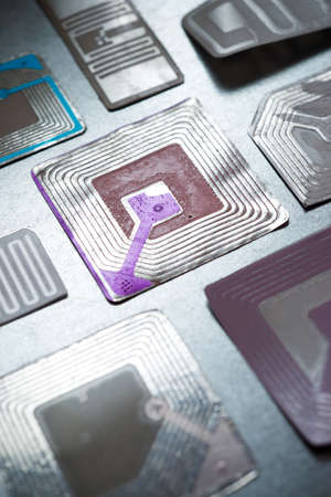 Rfid tags on a metal tableの写真素材