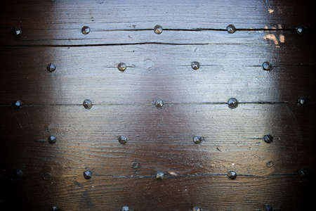 Closeup of an old wooden door in France.