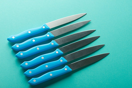 Kitchen knives with blue plastic handles.の写真素材