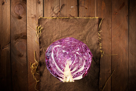 Red cabbage piece on a wood tableの写真素材