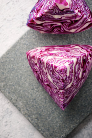 Red cabbage pieces on a chopping boardの写真素材