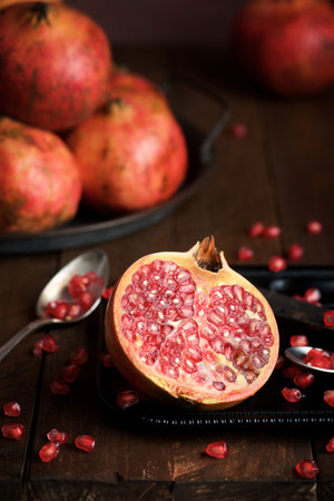 Pomegranates view on a wood tableの写真素材