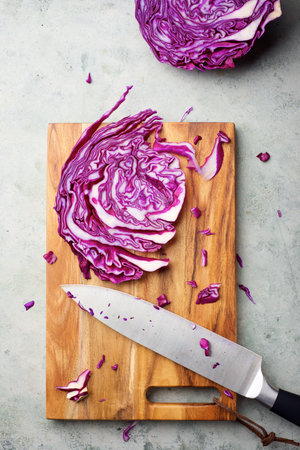 Red cabbage leaves on a chopping boardの写真素材