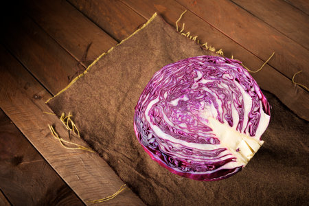 Red cabbage piece on a wood tableの写真素材