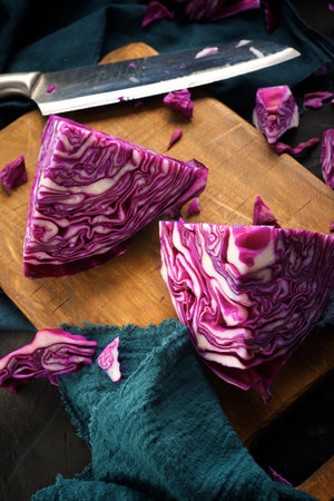 Red cabbage pieces on a chopping boardの写真素材