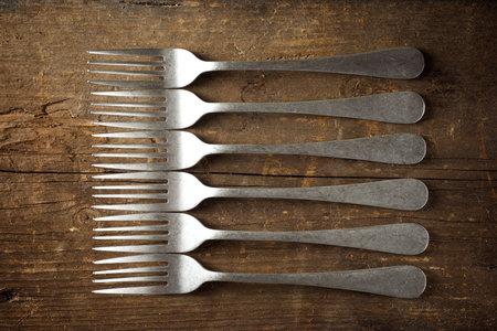 Close-up of metal forks on a diner table