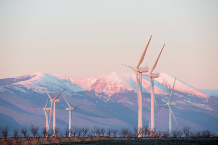 Wind turbines generators for green electrical energy production and Moncayo peak in Spain.