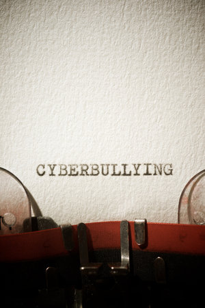Cyberbullying word written with a typewriter.の写真素材