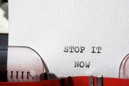 Stop it now text written with a typewriter.の写真素材