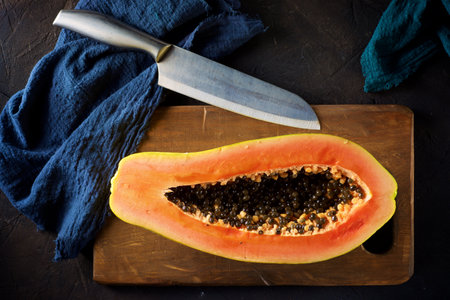 Papaya chunk on a black tableの写真素材