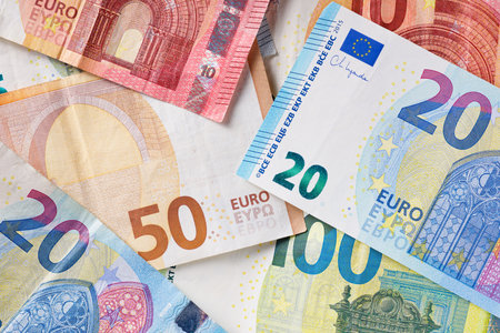 European Union banknotes stacked on a tableの写真素材