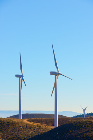 Silhouettes of windmills for the production of electric green energy in Spain.の写真素材