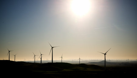 Silhouettes of windmills for the production of electric green energy in Spain.の写真素材
