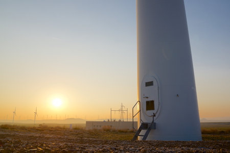 Wind turbine generators for sustainable electrical energy production at sunriseの写真素材