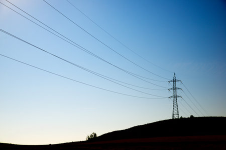 High voltage tower in a hill, Zaragoza Province in Spainの写真素材
