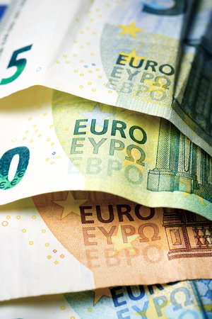 European Union banknotes stacked on a tableの写真素材