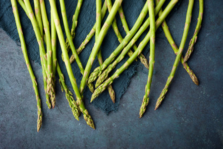 Wild asparagus on a stone table.の写真素材