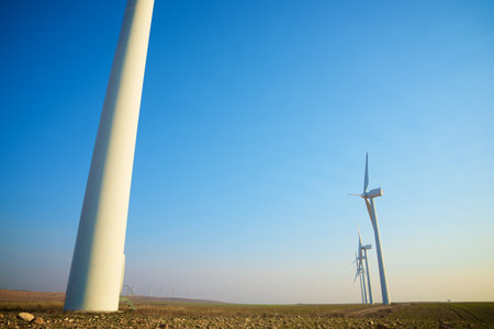 Wind turbine generators for sustainable electrical energy production at sunriseの写真素材