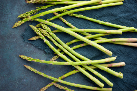 Wild asparagus on a stone table.の写真素材