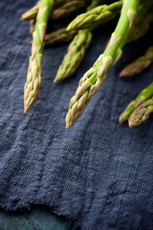 Group of wild asparagus on a tea towel.の写真素材