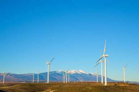 Wind turbines generators for green electrical energy production and Moncayo peak in Spain.の写真素材
