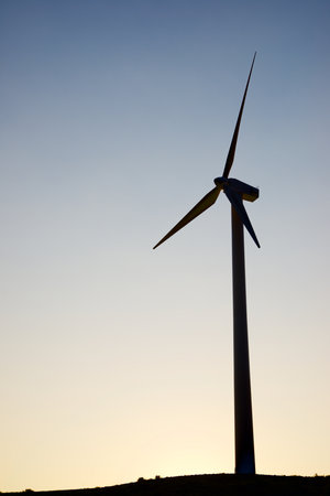 Wind turbine generator for sustainable electrical energy production at sunriseの写真素材