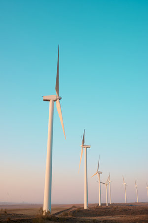 Wind turbine generators for sustainable electrical energy production at sunriseの写真素材