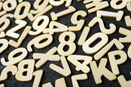 Top view of letters to play with on a black tableの写真素材