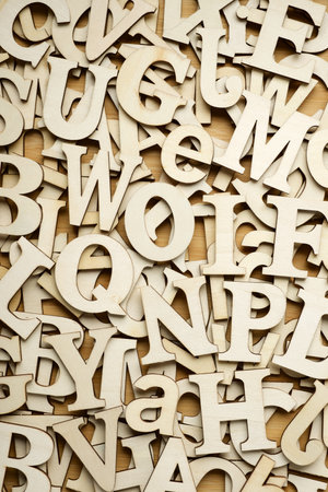 Top view of letters to play with on a wooden tableの写真素材