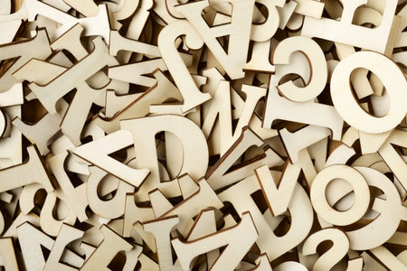 Close-up of stacked wooden letters for playの写真素材