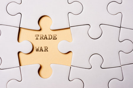 Trade war text written with a typewriter in a white puzzleの写真素材