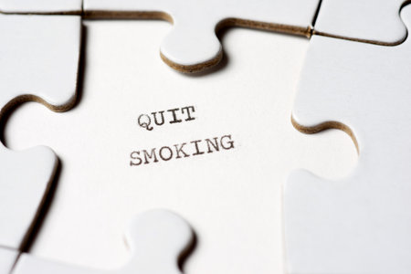 Quit smoking text written with a typewriter in a white puzzleの写真素材