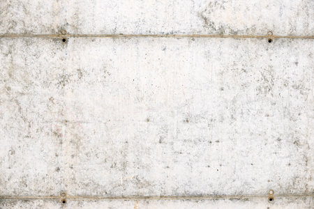 Texture of an old and weathered reinforced concrete wall.の写真素材