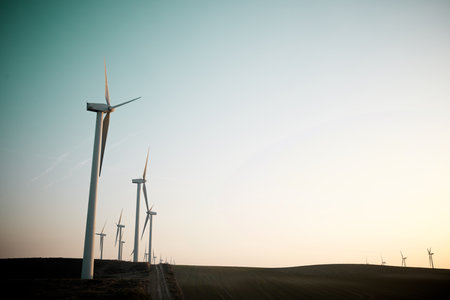 Wind turbine generators for sustainable electrical energy production at sunriseの写真素材