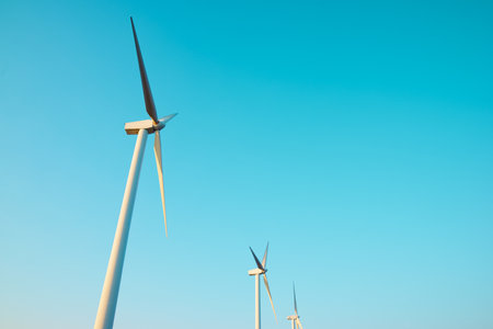 Wind turbine generators for sustainable electrical energy production at sunriseの写真素材