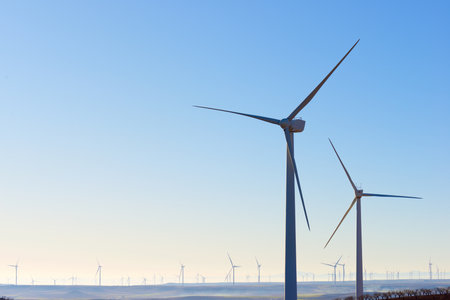 Silhouettes of windmills for the production of electric green energy in Spain.の写真素材
