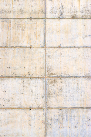 Texture of an old and weathered reinforced concrete wall.の写真素材