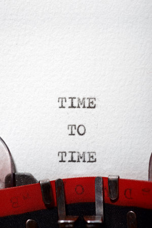 Time to time text written with a typewriter.の写真素材