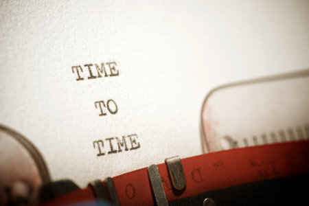 Time to time text written with a typewriter.の写真素材