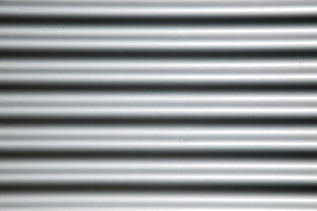Close-up of the galvanized metal facade of a factory.の写真素材