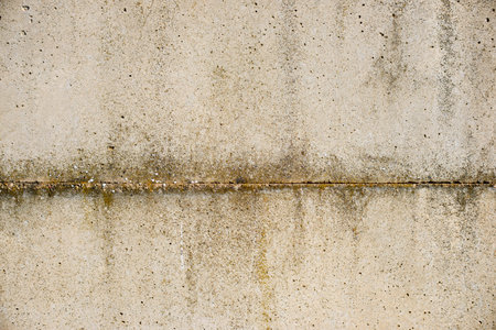 Texture of an old and weathered reinforced concrete wall.の写真素材