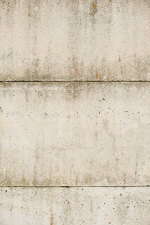 Texture of an old and weathered reinforced concrete wall.の写真素材