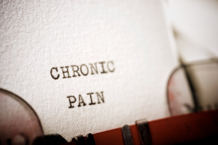 Chronic pain text written with a typewriter.の写真素材