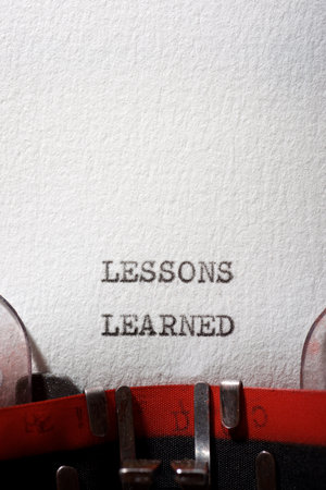 Lessons learned text written with a typewriter.の写真素材