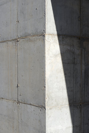 Texture of an old and weathered reinforced concrete wall.の写真素材