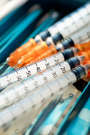 Closeup of a syringe to administer medicationの写真素材